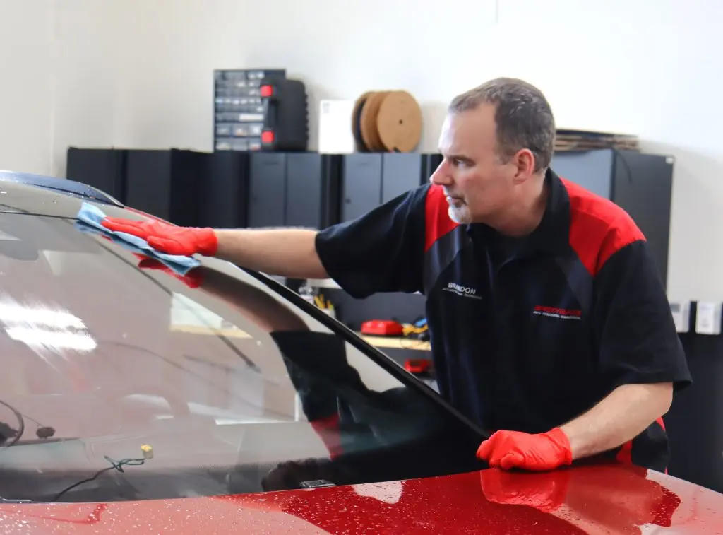 Virginia Beach auto glass technician preparing windshield replacement
